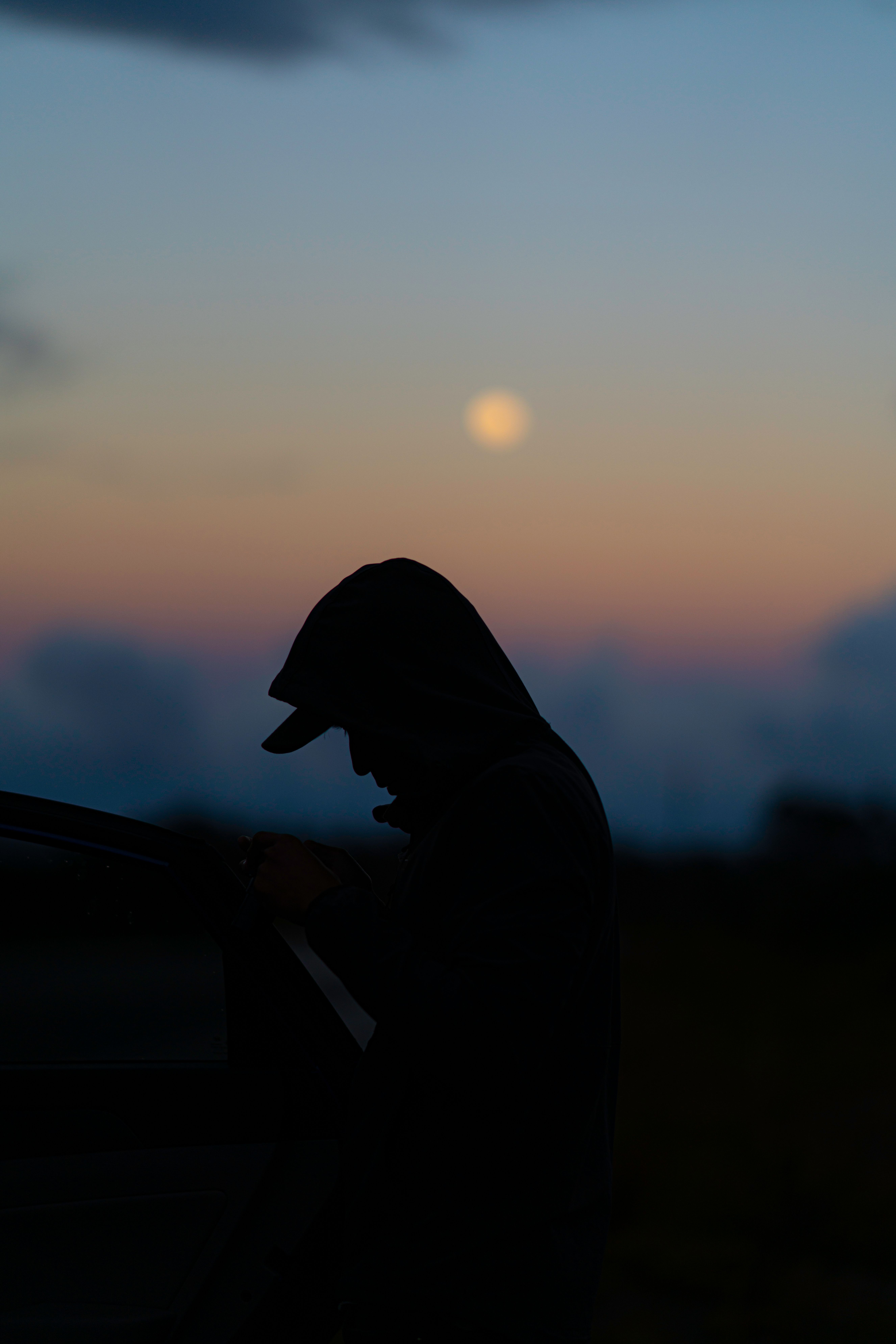 Silhouette of a person under the evening sky